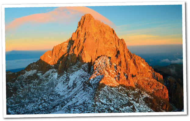 Pink cloud floats above Mt  Kenya during sunrise  Snow at the equator  