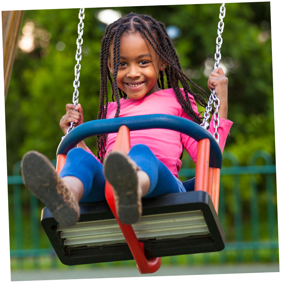 Outdoor  portrait of a cute young black girl playing with a swing - African people; Shutterstock ID 137847329; PO: 4002288; Job: Shine On level 1 (Italy); Client: Sophia Matthew